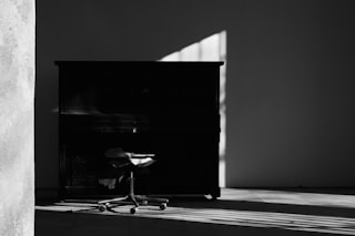 a black and white photo of a chair in a room